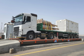 Flatbed trailer rental Saudi Arabia — steel pipes and industrial cargo transport hire KSA. Flatbed trailer hire Riyadh Jeddah — construction steel and pipe transport Saudi Arabia KSA