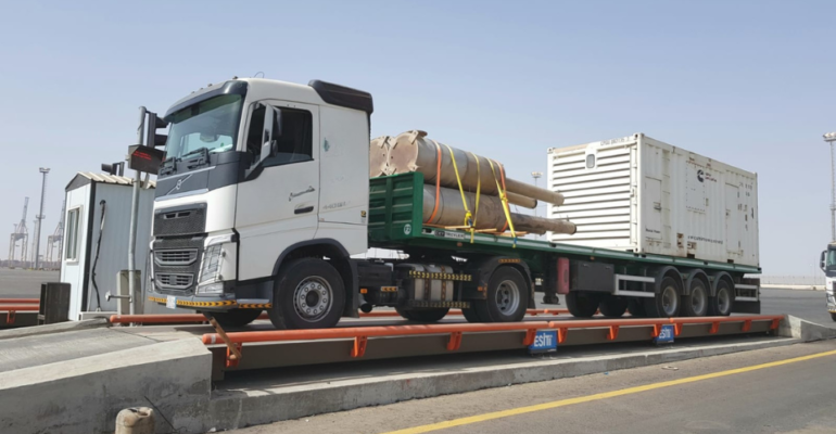 Flatbed trailer rental Saudi Arabia — steel pipes and industrial cargo transport hire KSA. Flatbed trailer hire Riyadh Jeddah — construction steel and pipe transport Saudi Arabia KSA