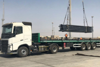 U frame flatbed trailer rental Saudi Arabia — glass and facade panel transport hire KSA. A frame trailer hire curtain wall glass Saudi Arabia — facade panel transport Riyadh Jeddah KSA