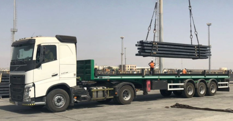 U frame flatbed trailer rental Saudi Arabia — glass and facade panel transport hire KSA. A frame trailer hire curtain wall glass Saudi Arabia — facade panel transport Riyadh Jeddah KSA